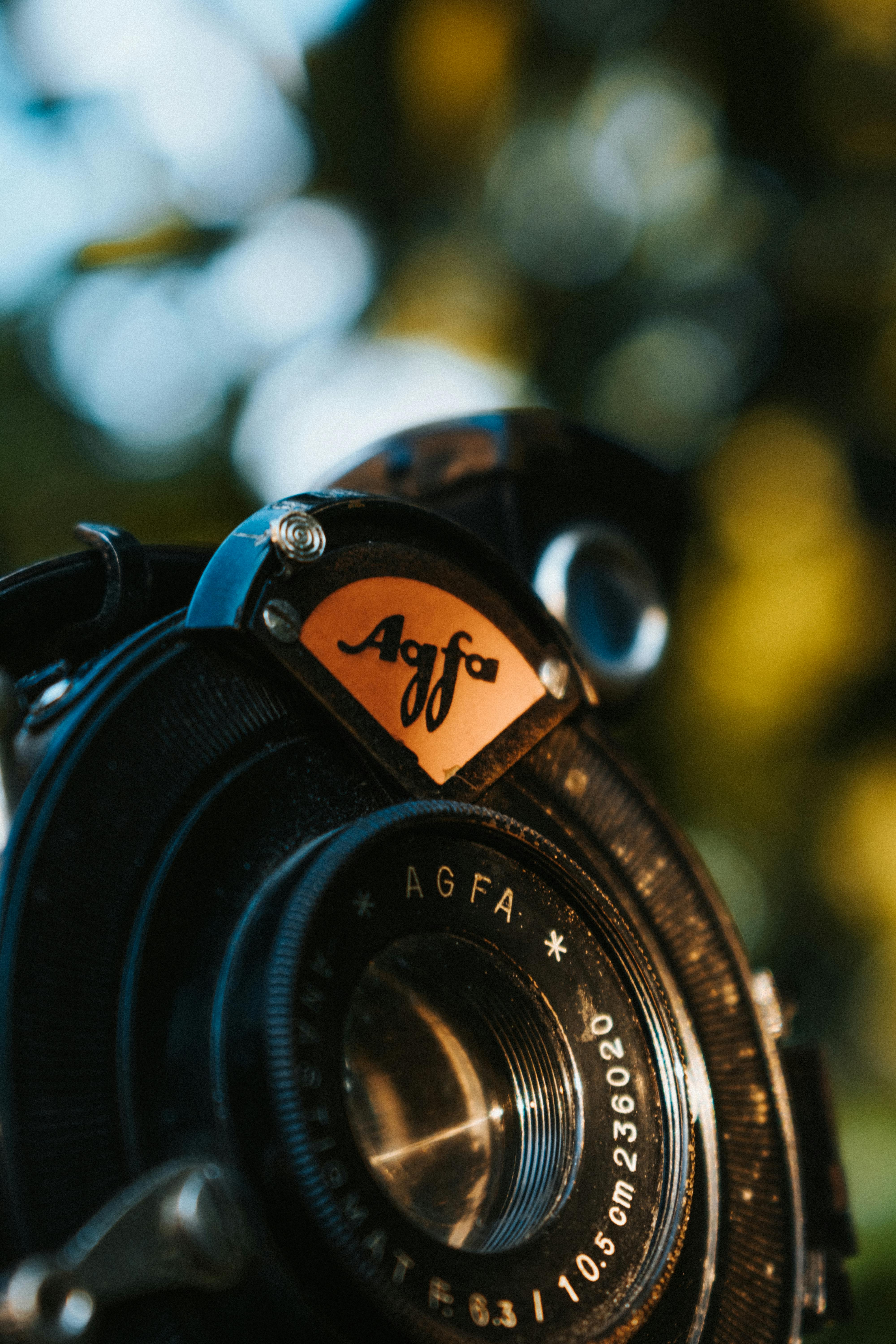 Close-up of a vintage Agfa camera lens, showcasing classic design and beautiful bokeh background.
