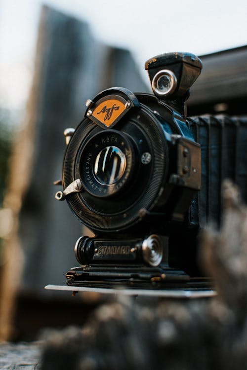 Free Black Nikon Dslr Camera on Brown Wooden Table Stock Photo