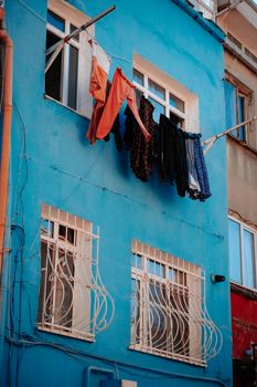 Clothes Hanged on White Metal Rack