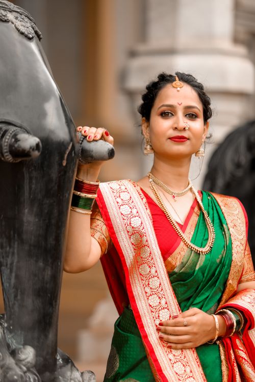 Free Elegant Indian woman posing in a vibrant traditional saree, exemplifying cultural heritage. Stock Photo