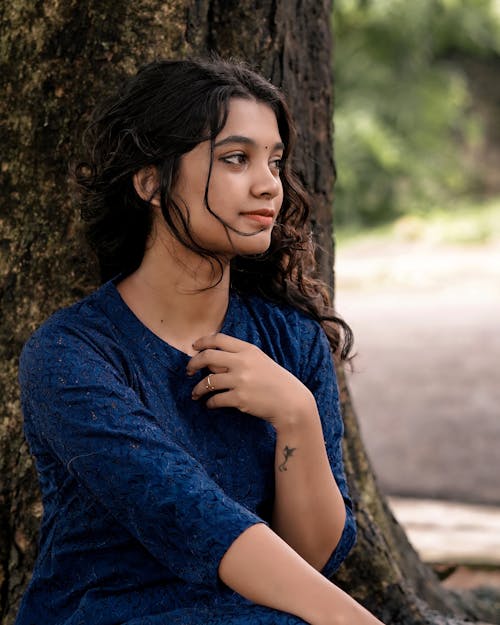 Photo of Woman in Blue Top near Tree