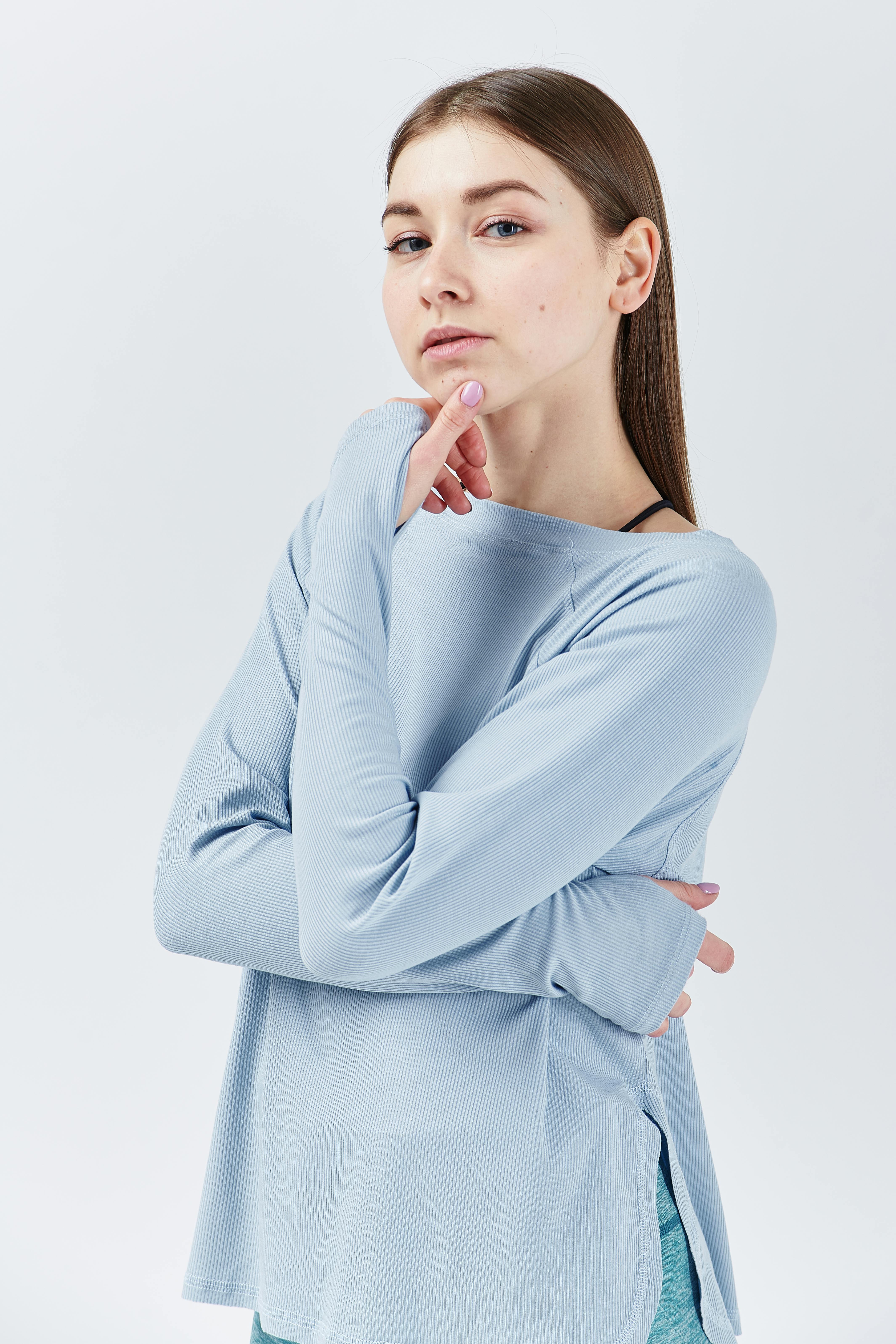 a woman in blue long sleeve shirt