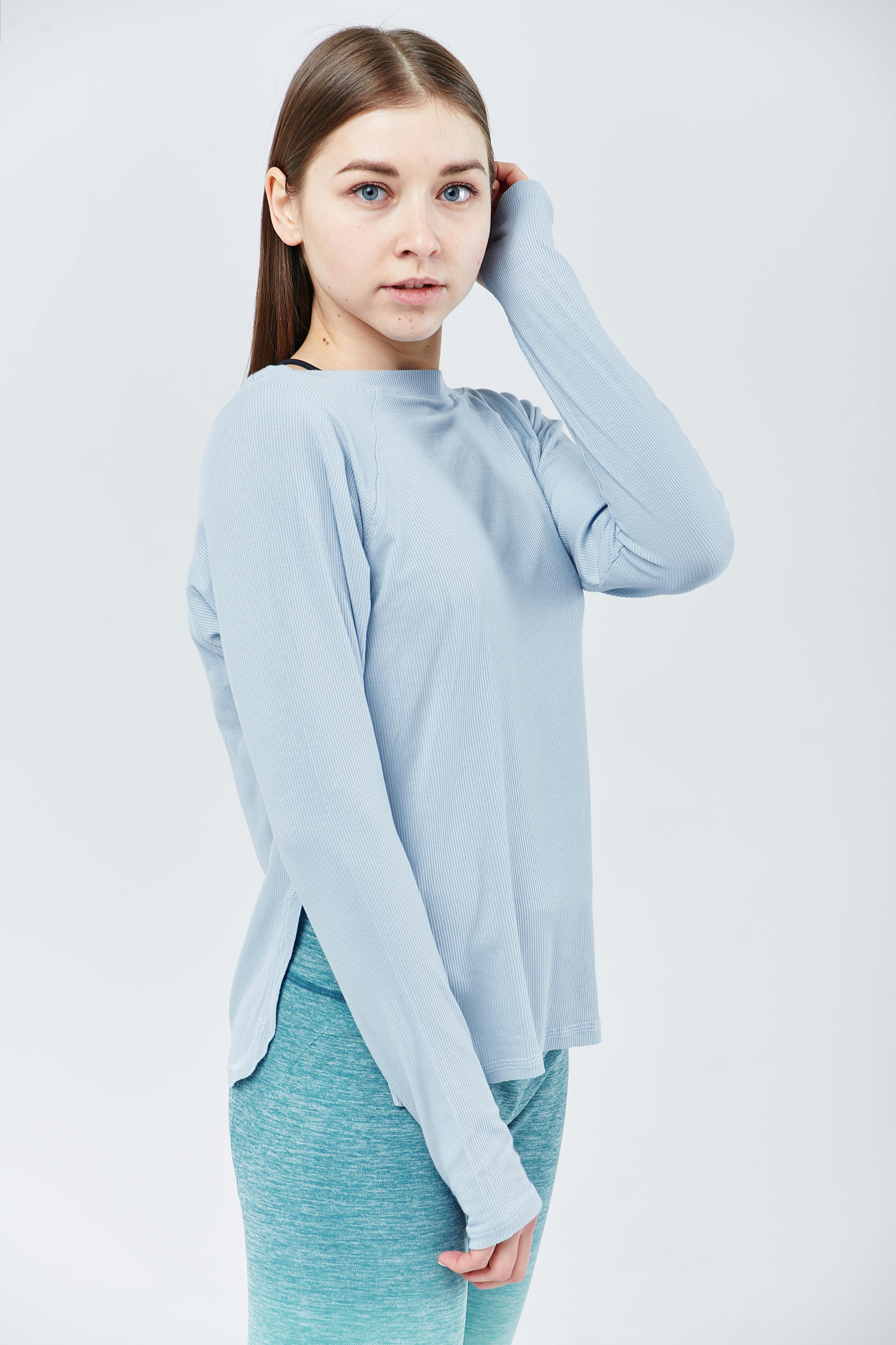 young woman in blue long sleeves shirt