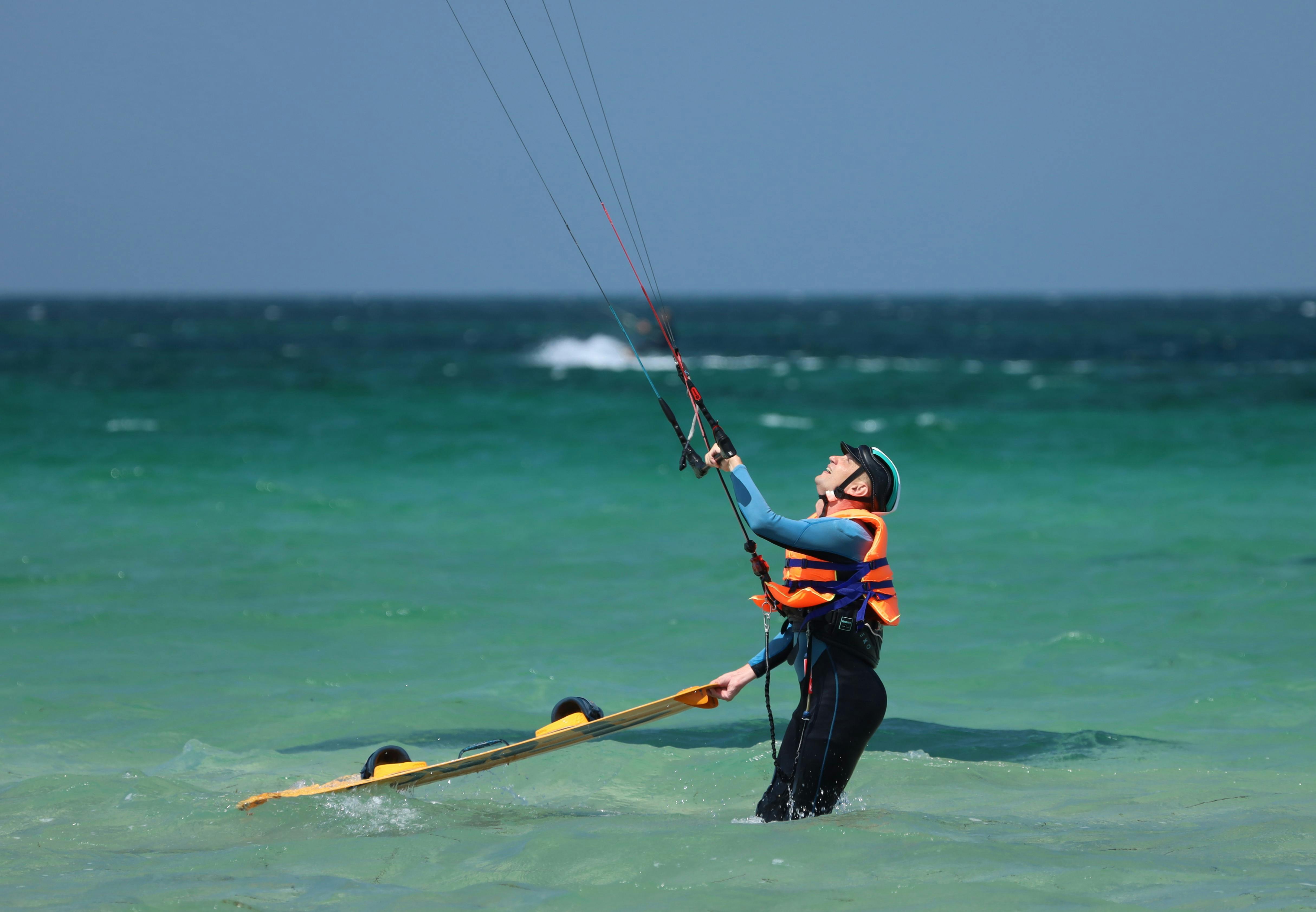 A Man Kite Boarding at Sea · Free Stock Photo