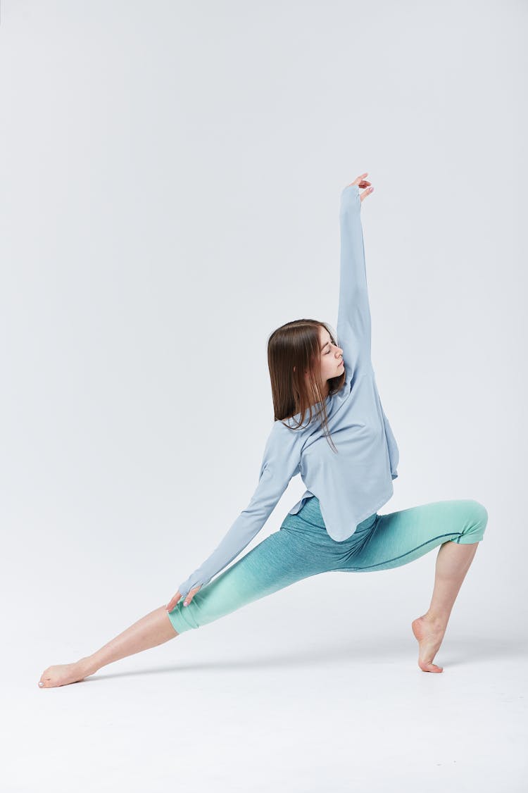 Brunette Woman Stretching Her Arm And Legs 