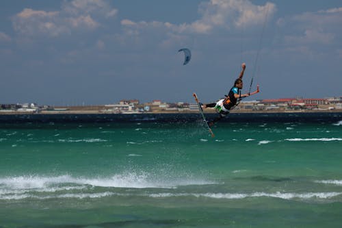 A Man Surfing on Sea