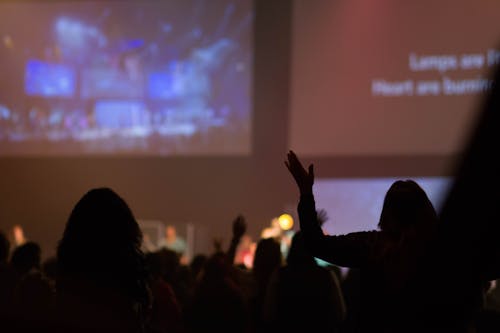 Free stock photo of arms raised, church, concert