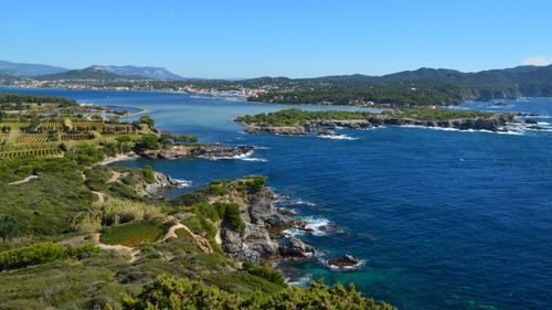 Free A beautiful aerial view of a rugged coastline with cliffs and blue sea on a clear day. Stock Photo