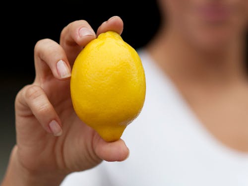 Person Holding Yellow Lemon Fruit