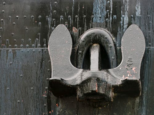 Iron Shoe Soles on Metal Wall