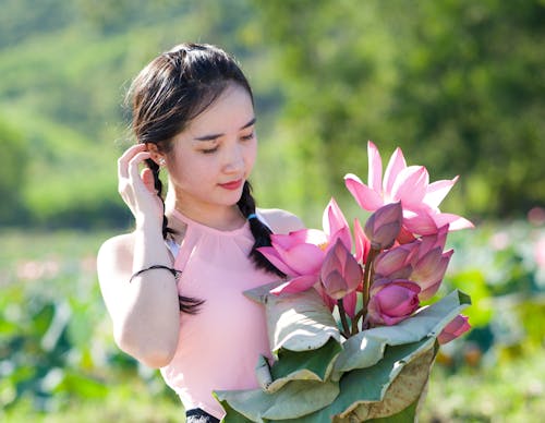 Beautiful Woman Holding Pink Flowers