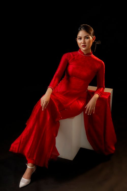 A Woman in Red Long Sleeve Dress Sitting on White Bench · Free Stock Photo