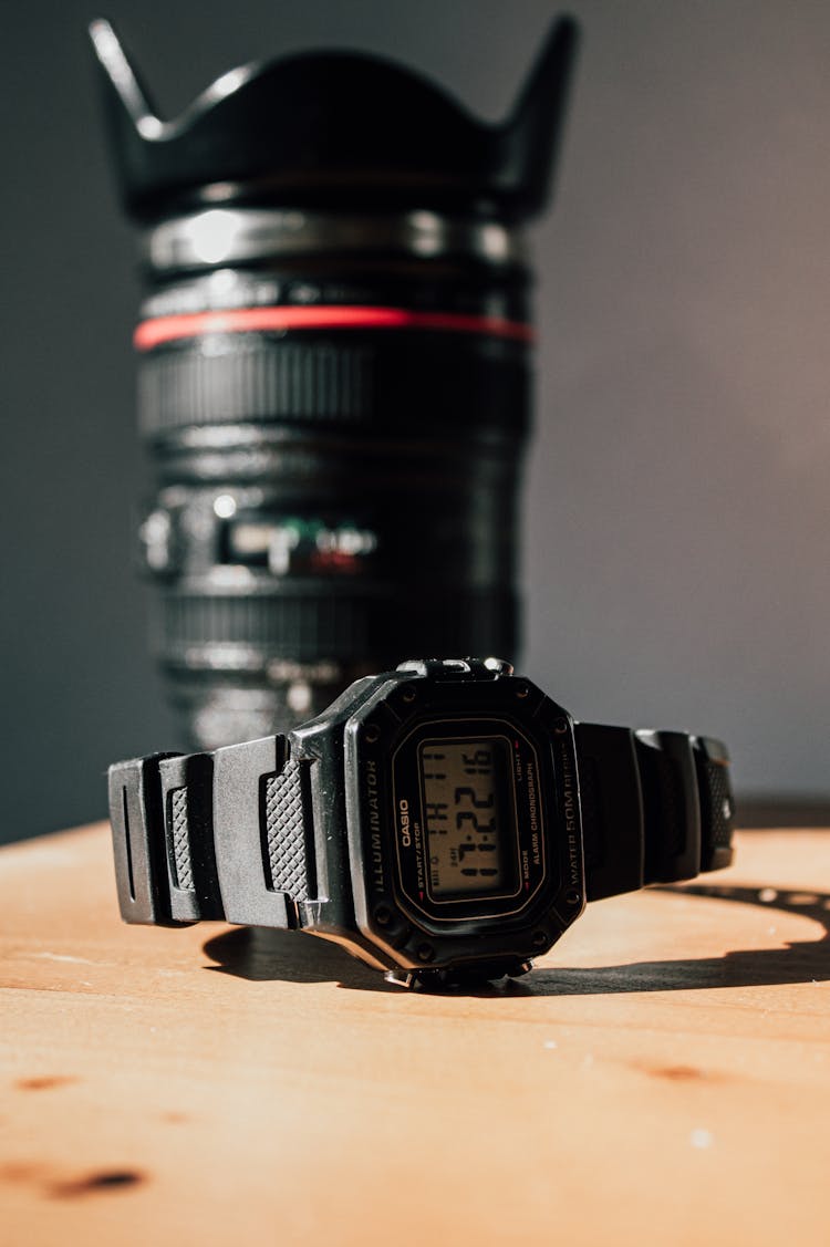 Black Casio Digital Watch On The Wooden Surface 