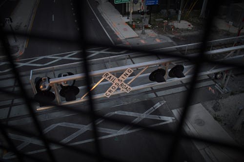 A Rail Road Crossing Sign on a Steel Structure