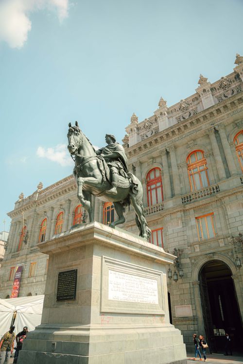 Free Statue of Charles IV outside the National Museum in Mexico City. Historical landmark. Stock Photo