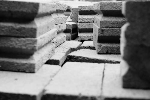 pile of concrete brick in black and white