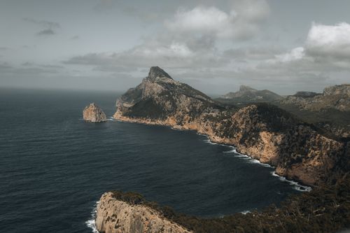 Free A stunning aerial view of the rugged coastline and cliffs of Cap de Formentor in Mallorca, Spain. Stock Photo