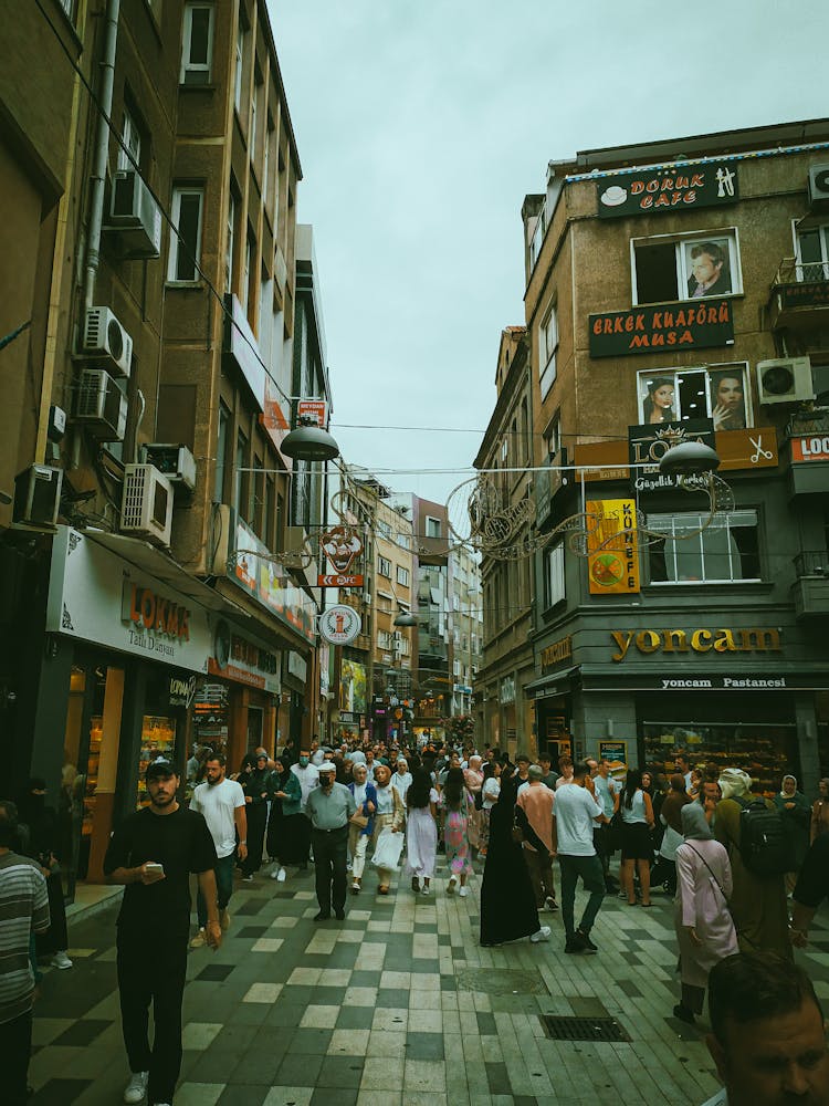 Crowd Of People Walking On A Downtown