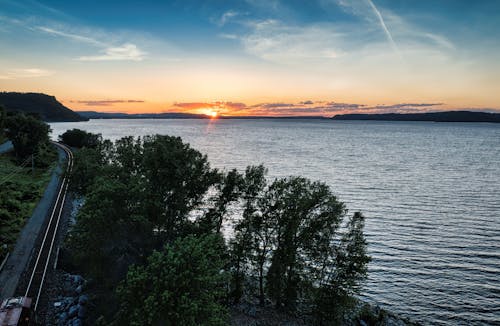 Gratis stockfoto met bomen, gebied met water, gouden uur