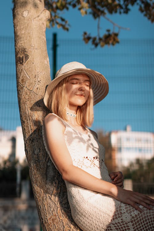 Smiling Blonde Woman in Hat