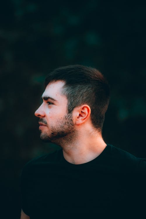 Side View Photography of Man in Black Crew Neck Shirt