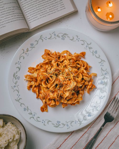 Red Pasta on White Ceramic Plate