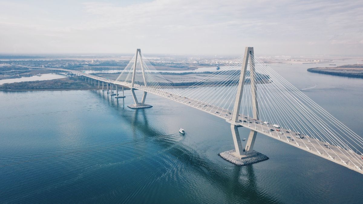 Aerial view of the Arthur Ravenel Jr. Bridge over the Cooper River in Charleston, a daily crossing for many people moving to Charleston SC