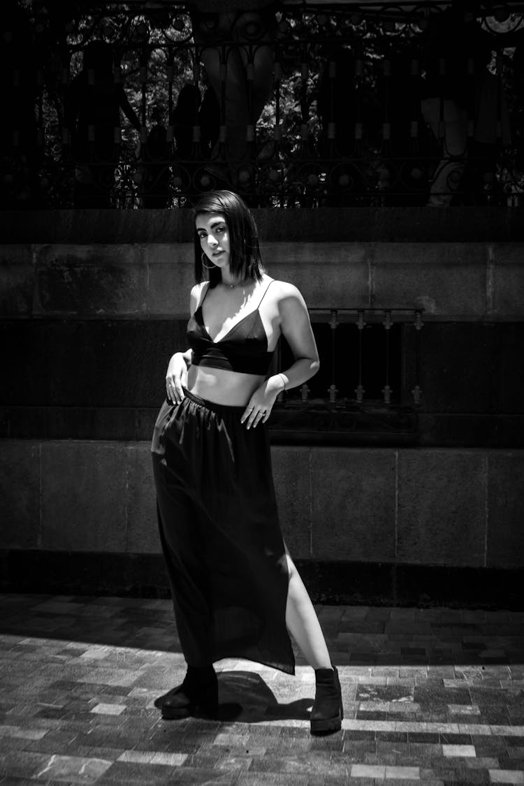 Woman In Black Halter Crop Top Posing Hands On Her Waist