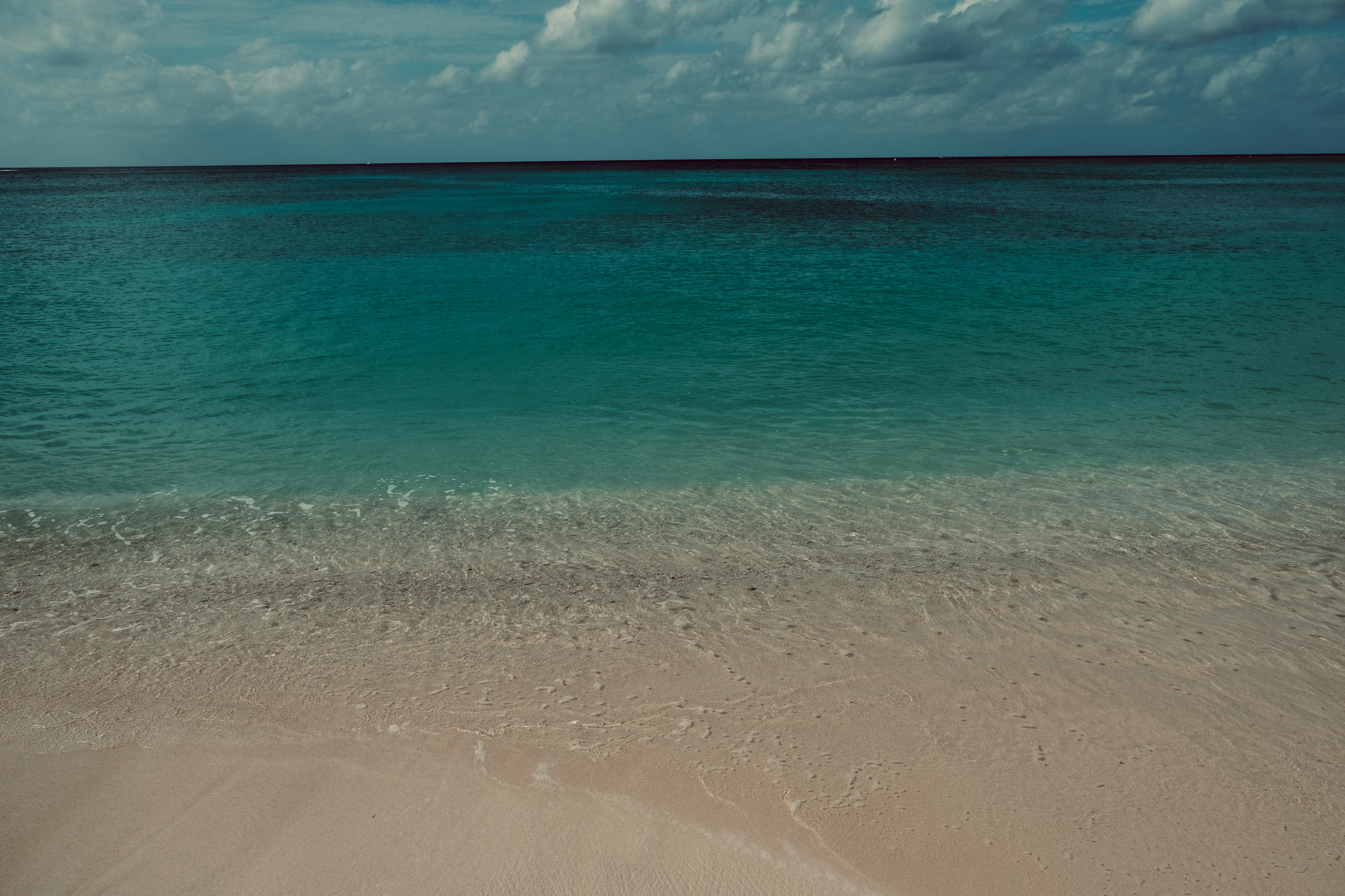 Discover the serene beach and crystal-clear waters of Cuba, perfect for relaxation and escape.