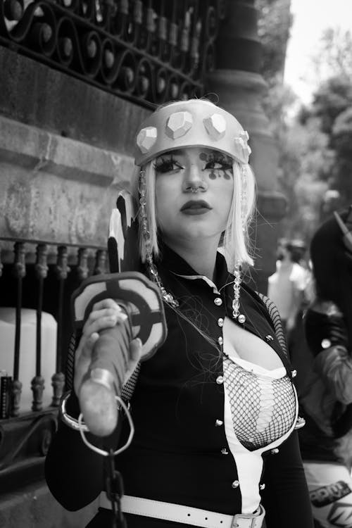 Grayscale Photo of a Female Cosplayer Wearing Her Costume