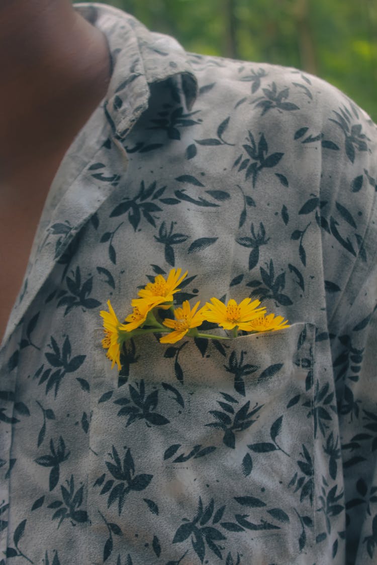 Close-up Of Flowers In A Mans Shirt Pocket 