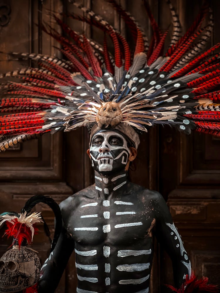 Man Wearing A Feather Headdress