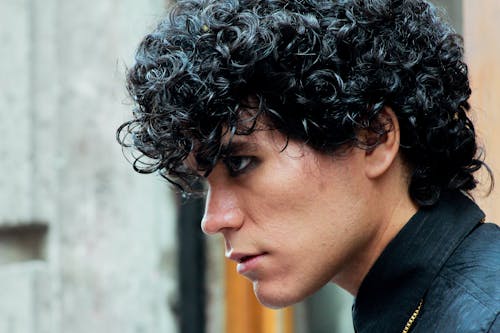 Man with Curly Hair Looking Away