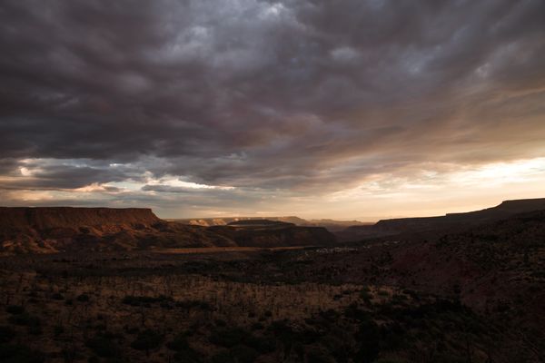 Canyon landscape under dramatic clouds at twilight — photo by Tim Mossholder on Pexels