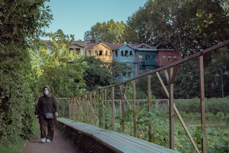 Woman Wearing Hijab And Facemask Walking 