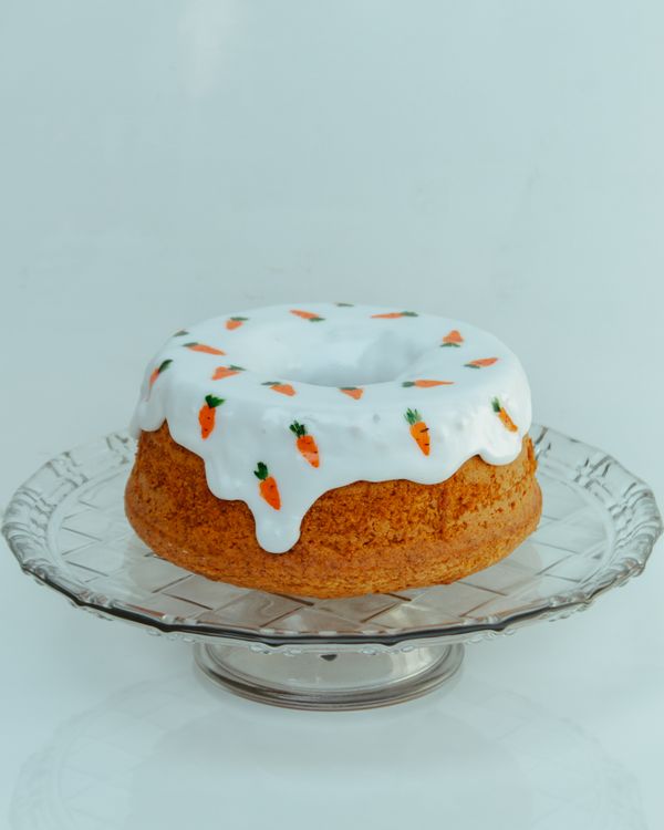 Homemade carrot cake topped with white icing — photo by Igor Alves on Pexels