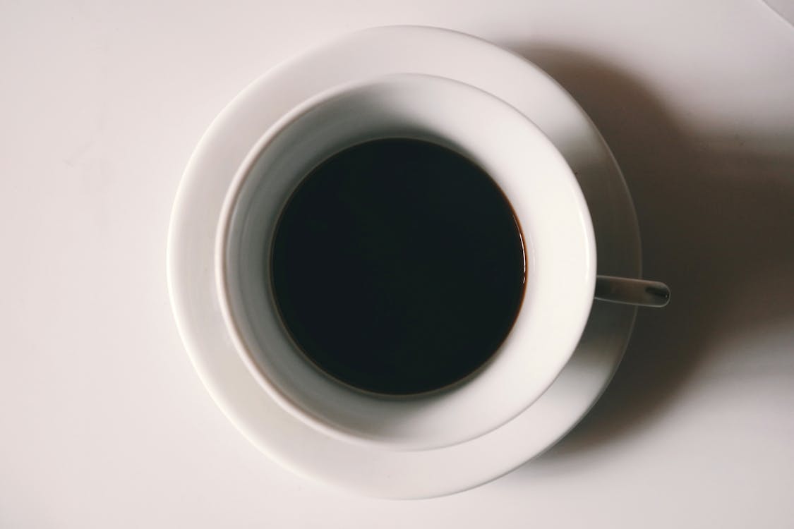 Black Liquid in White Ceramic Mug