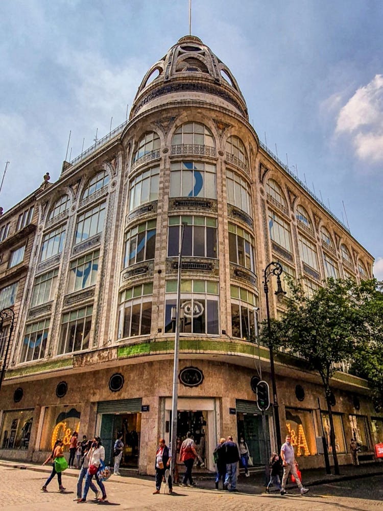 People Standing Near El Palacio De Hierro Centro