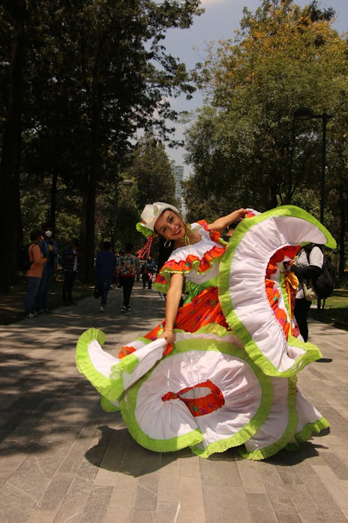 Mexican Woman in Traditional Dress Dancing on Street