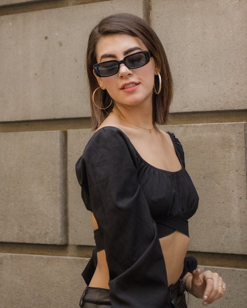 Woman in Black Scoop Neck Shirt Wearing Black Sunglasses