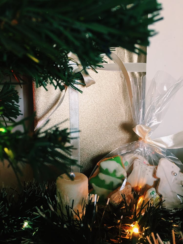 White Pillar Candle On Green Christmas Tree