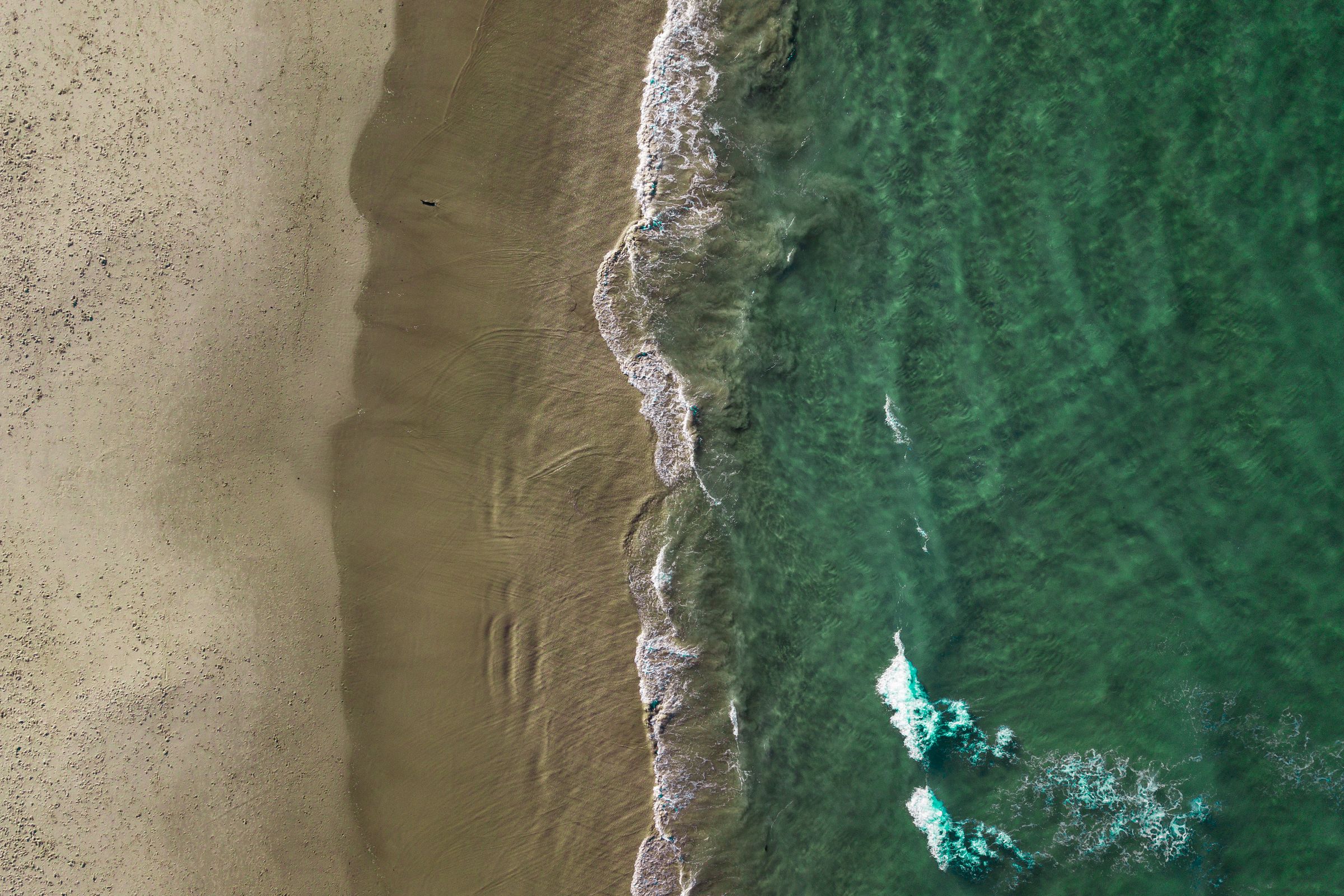 Soft morning light over the calm coastline at Burleigh Heads on the Gold Coast