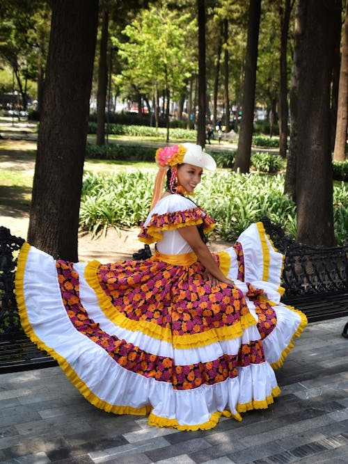 Smiling Woman in Traditional Dress at Park