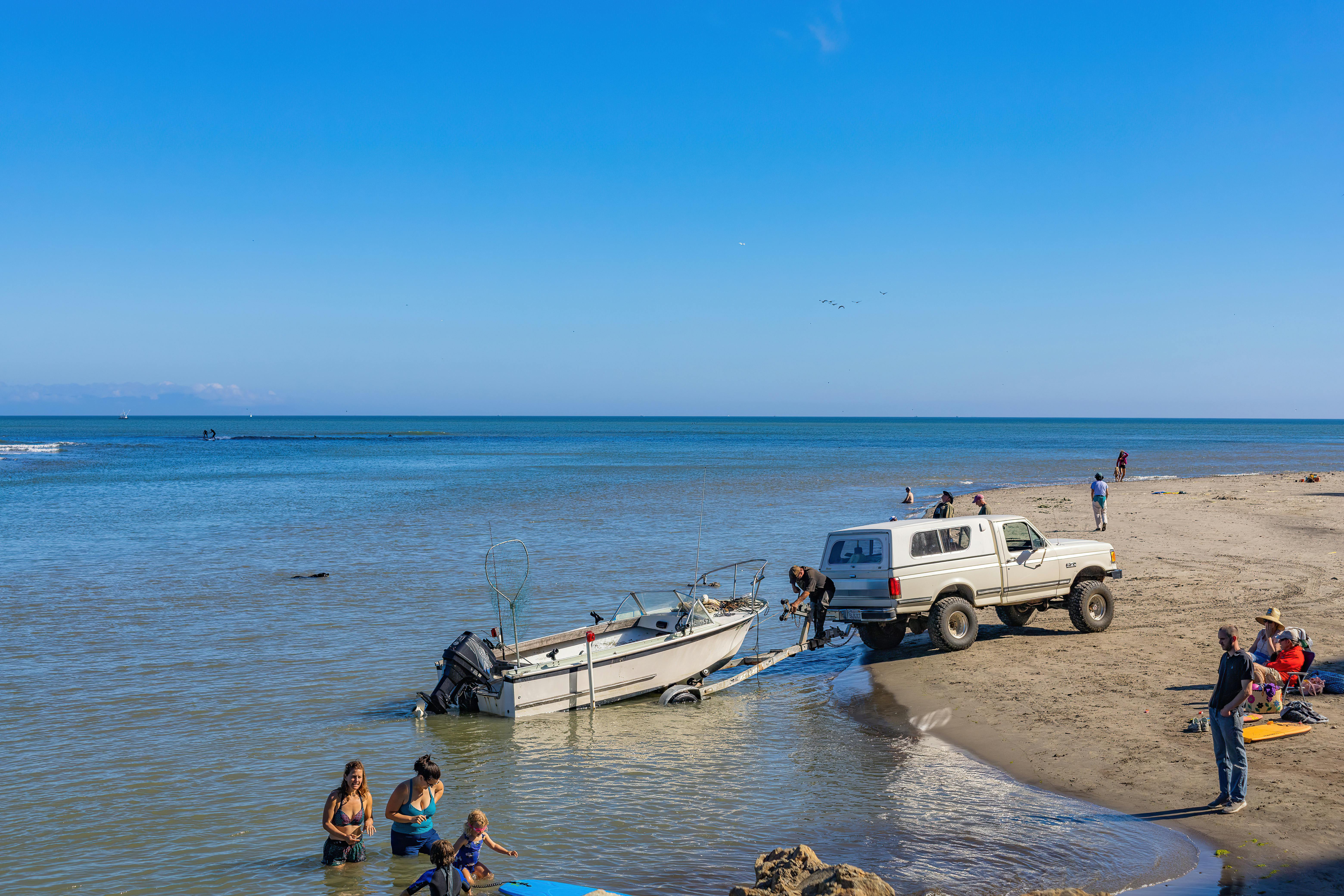 a surf boat being towed by a truck - Best surf boats 2023