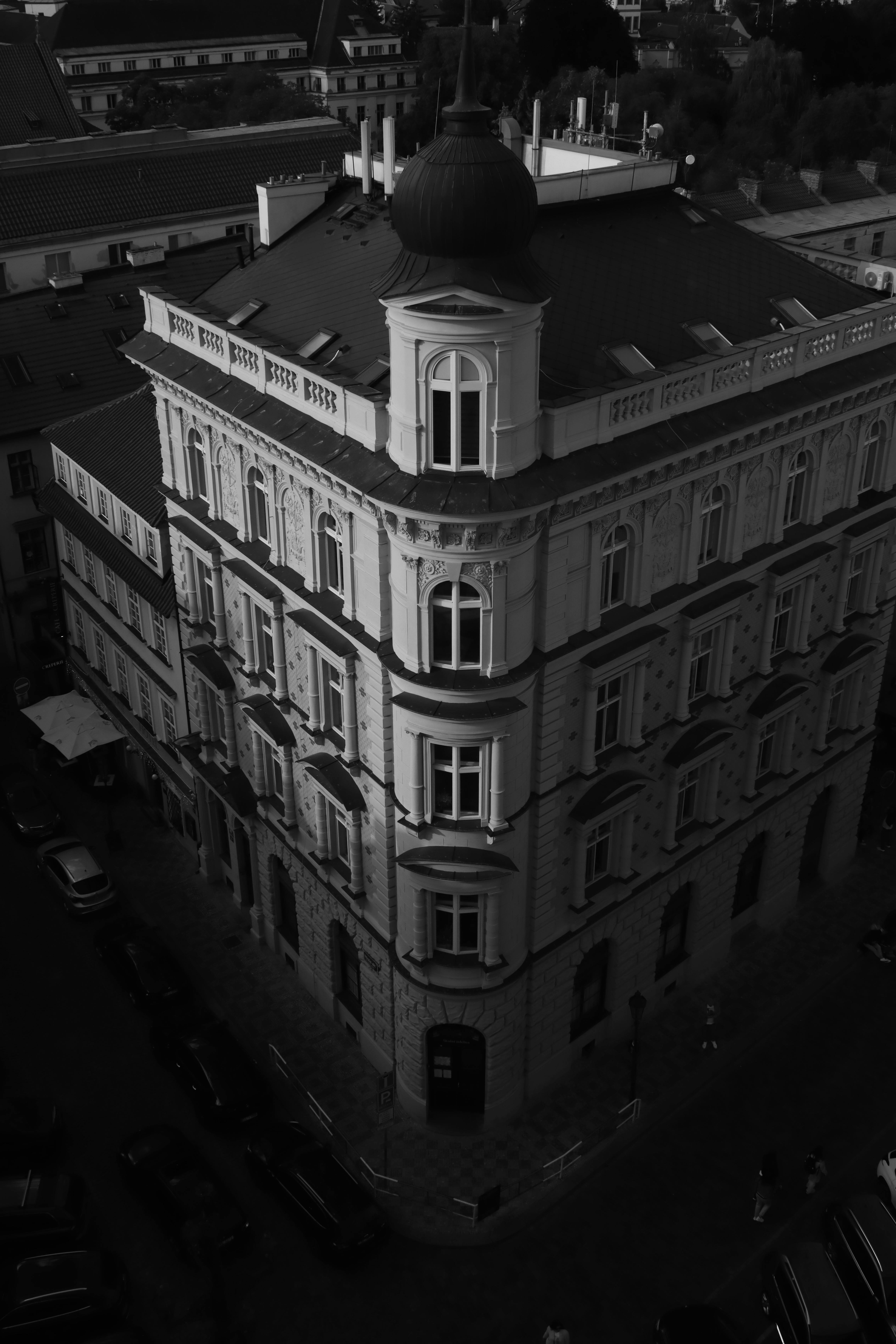 Free Black and white photo of a baroque building in Prague, Czechia from a high angle. Stock Photo