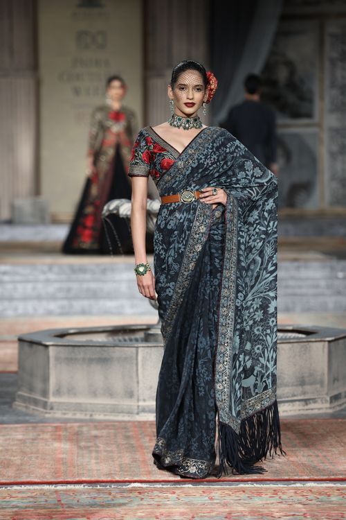 Free Model in elegant saree at fashion show, showcasing traditional style. Stock Photo
