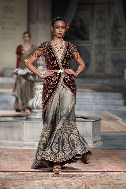 Model Walking on a Runway in Traditional Clothing Free Stock Photo Model Walking on a Runway in Traditional Clothing Free Stock Photo