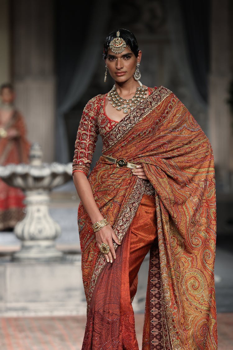 A Fashion Model Wearing Orange Dress