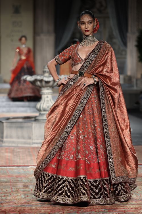 Free A model gracefully posing in traditional Indian attire on a fashion runway. Stock Photo