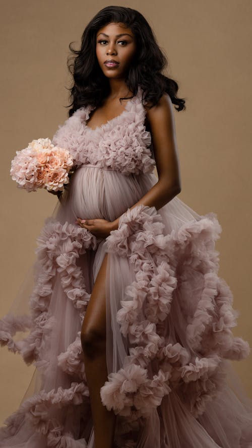 A Pregnant Woman Wearing Pink Dress